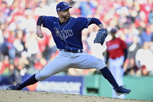 FILE - Tampa Bay Rays' Corey Kluber pitches in the 13th inning of a wild card baseball playoff game against the Cleveland Guardians on Oct. 8, 2022, in Cleveland. The Boston Red Sox and Kluber agreed to a $10 million, one-year contract on Wednesday, Dec. 28, 2022, adding the veteran right-hander to the team's rotation. (AP Photo/David Dermer, File)