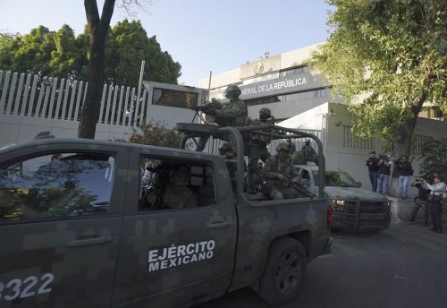 A heavily armed army convoy departs the prosecutor's building where Ovidio Guzmán, one of the sons of former Sinaloa cartel boss Joaquin 