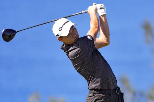 Collin Morikawa plays his shot from the 13th tee during the final round of the Tournament of Champions golf event, Sunday, Jan. 8, 2023, at Kapalua Plantation Course in Kapalua, Hawaii. (AP Photo/Matt York)