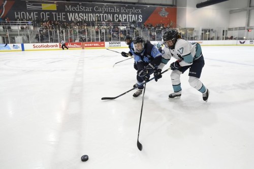 Team Sonnet defender Katherine Bailey, right, and Team Bauer forward Meghan Grieves reach for the puck during the second period of a hockey game as part of the Secret Dream Gap Tour, Friday, March 4, 2022, in Arlington, Va. The Professional Women's Hockey Players' Association and the NHL's Tampa Bay Lightning will co-host a four-game Dream Gap Tour event in February.THE CANADIAN PRESS/AP-Nick Wass