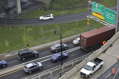 FILE - Traffic is seen near the entrance to the Holland Tunnel in Jersey City, N.J., April 27, 2017. State and local governments will soon gain new flexibility to spend billions of federal coronavirus relief dollars on things not directly related to the pandemic, including new roads and bridges and aid to people affected by wildfires, floods and other natural disasters. (AP Photo/Seth Wenig, File)