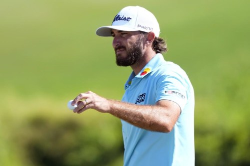 Max Homa acknowledges the gallery from the 18th green during the final round of the Tournament of Champions golf event, Sunday, Jan. 8, 2023, at Kapalua Plantation Course in Kapalua, Hawaii. (AP Photo/Matt York)