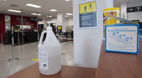 Hand sanitizer, face masks and wipes are available at the entrance of a Service Canada office Tuesday July 7, 2020 in Gatineau, Quebec. Provinces are awash with expired hand sanitizer that Ottawa sent them during the height of the COVID-19 pandemic.THE CANADIAN PRESS/Adrian Wyld