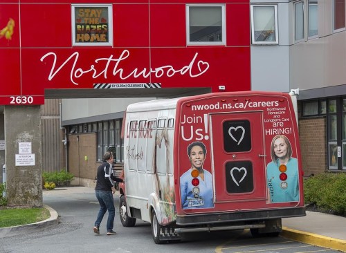 A driver enters a shuttle bus at Northwood Manor, one of the largest nursing homes in Atlantic Canada, in Halifax on Tuesday, June 2, 2020. The Nova Scotia government says it will add an additional 600 new single bed long-term care rooms across the province to try to meet current and future demand. THE CANADIAN PRESS/Andrew Vaughan