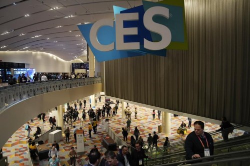 People walk through the Venetian Expo center during the CES tech show Thursday, Jan. 5, 2023, in Las Vegas. (AP Photo/John Locher)