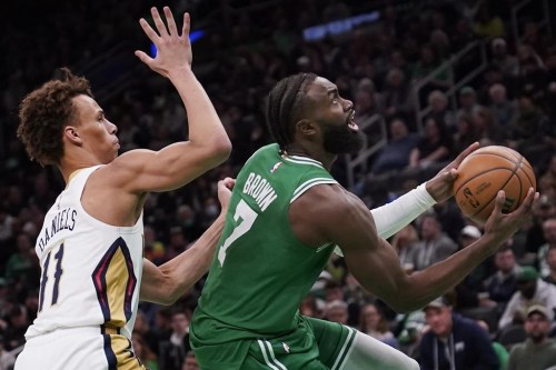 Boston Celtics guard Jaylen Brown (7) drives to the basket past New Orleans Pelicans guard Dyson Daniels (11) during the second half of an NBA basketball game, Wednesday, Jan. 11, 2023, in Boston. (AP Photo/Charles Krupa)