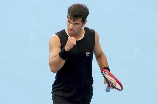 Marcos Giron of the United States reacts after a play against Richard Gasquet of France during their Round of 32 match at the Adelaide International tennis tournament in Adelaide, Australia, Sunday, Jan. 1, 2023. (AP Photo/Kelly Barnes)