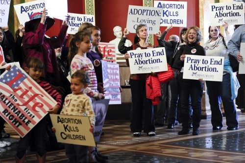 FILE - Protesters fill the Montana state Capitol rotunda in Helena, Mont., on Feb. 11, 2015, during a rally to show support in an attempt to change the Montana Constitution to define life as beginning at conception. State officials in Republican-controlled Montana want to require prior authorization before its health department pays for abortions for people covered by Medicaid, a proposal critics say would reduce access and delay or even prevent abortion care for low-income women in a state. (Thom Bridge/Independent Record via AP, File)