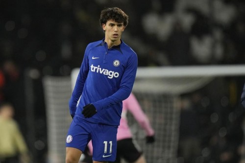 Chelsea's Joao Felix warms up before the English Premier League soccer match between Fulham and Chelsea at the Craven Cottage stadium in London Thursday, Jan. 12, 2023. (AP Photo/Alastair Grant)