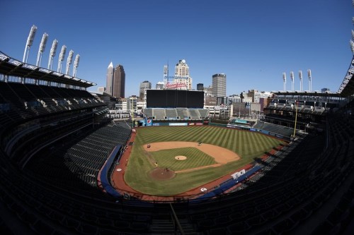 FILE -Workers finish installing the Cleveland Guardians sign above the scoreboard at Progressive Field, Thursday, March 17, 2022, in Cleveland. Back among the World Series title contenders, the Cleveland Guardians are moving forward with upgrades to Progressive Field. The team revealed on Thursday, Jan. 12, 2023 the final plans for a “reimagining” of its downtown home, which has aged well since opening in 1994 but is now the 11th oldest ballpark in Major League Baseball.(AP Photo/Ron Schwane, File)