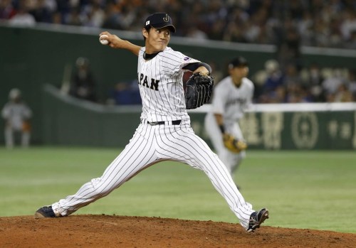 FILE - Japan pitcher Shintaro Fujinami pitches against the Netherlands in the sixth inning of an international exhibition series baseball game at Tokyo Dome in Tokyo, Nov. 12, 2016. Right-hander Fujinami has reached agreement on a $3.25 million, one-year contract with the Oakland Athletics, according to a person with direct knowledge of the deal. The person spoke on condition of anonymity Thursday, Jan. 12, 2023, because Fujinami’s contract is pending a physical to be finalized. (AP Photo/Toru Takahashi, File)