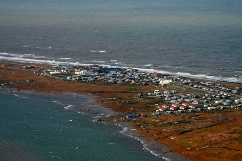 FILE - In this image provided by the U.S. Coast Guard, a search and rescue and damage assessment in Deering, Alaska, shows the damage caused by Typhoon Merbok, Sept. 18, 2022. After the remnants of a rare typhoon caused extensive damage along Alaska's western coast last fall, the U.S. government stepped in to help residents, largely Alaska Natives, recovery financially. (Petty Officer 3rd Class Ian Gray/U.S. Coast Guard via AP, File)