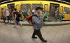 FILE --People wear face masks to protect themself against the coronavirus as they leave and get on board of a subway train in Berlin, Germany, Tuesday, June 23, 2020. Germany's health minister says the country will soon drop a mask mandate in long-distance trains and buses, one of the country’s last remaining COVID-19 restrictions. Rules for local transport are a matter for Germany’s 16 state governments. (AP Photo/Michael Sohn,file)