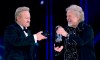 Randy Bachman (right) holds the Juno as Robbie Bachman videotapes a closeup of the trophy after being inducted into the Canadian Music Hall of Fame at the Juno Awards in Winnipeg, Sunday, March 30, 2014. Robbie Bachman, co-founder and drummer of Bachman-Turner Overdrive, has died at 69, representatives for his brother Randy confirm. THE CANADIAN PRESS/John Woods