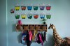 Ontario could be short 8,500 registered early childhood educators as the province adds tens of thousands more child-care spaces under the national $10-a-day program, the government estimates. Children's backpacks and shoes are seen at a daycare franchise, in Langley, B.C., on May 29, 2018. THE CANADIAN PRESS/Darryl Dyck