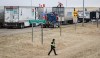Demonstrators gather as a truck convoy blocks the highway at the busy U.S. border crossing in Coutts, Alta., Monday, Jan. 31, 2022.&nbsp;Alberta Premier Danielle Smith has asked for an email search this weekend to determine if her staff have been contacting Crown prosecutors and interfering in cases involving the Coutts, Alta., border crossing blockade. THE CANADIAN PRESS/Jeff McIntosh