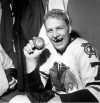 In this March 25, 1962 file photo Bobby Hull of the Chicago Blackhawks holds the puck after scoring his 50th goal of the season at New York's Madison Square Garden. Hockey Hall of Famer Bobby Hull has died at age 84. THE CANADIAN PRESS/AP Photo