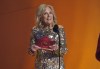 First Lady Jill Biden presents the award for song of the year at the 65th annual Grammy Awards on Sunday, Feb. 5, 2023, in Los Angeles. (AP Photo/Chris Pizzello)