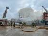 Three businesses are destroyed after a fire broke out the 800 block of Main Street Saturday. (David Lipnowski / Winnipeg Free Press)