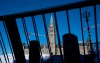 Protesters returned to Ottawa in significantly smaller numbers today to mark the one-year anniversary of the Liberal government's invocation of the Emergencies Act. Increased temporary security measures are seen blocking access to Parliament Hill, Tuesday, Feb. 14, 2023 in Ottawa.THE CANADIAN PRESS/Adrian Wyld