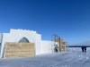 Workers construct a snow castle on Great Slave Lake's Yellowknife Bay, in Yellowknife, Tuesday, Feb. 14, 2023. THE CANADIAN PRESS/Emily Blake