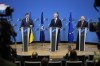 From left, Ukraine's Foreign Minister Dmytro Kuleba, NATO Secretary General Jens Stoltenberg and European Union foreign policy chief Josep Borrell address a media conference at NATO headquarters in Brussels, Tuesday, Feb. 21, 2023. (AP Photo/Virginia Mayo)