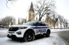 An Ottawa Police officer sits in their cruiser on Wellington Street below Parliament Hill in Ottawa, on Friday, Jan. 27, 2023. Ottawa police are committing to changing the way they respond to mental health calls as critics condemn a proposal to boost the policing budget by more than $15 million. THE CANADIAN PRESS/Justin Tang