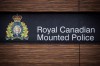 RCMP say two teenage girls died in the cold outside a home on a remote First Nation in Manitoba. The RCMP logo is seen outside Royal Canadian Mounted Police 