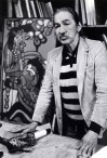 Indigenous artist Norval Morrisseau says he is heppy sketching in the streets of Vancouver as he poses in front of one of his earlier paintings at a Vancouver gallery on Monday, May 11, 1987. The OPP say they have been investigating alleged fraudulent art that is being made and sold under Morrisseau's name. THE CANADIAN PRESS/Chuck Stoody
