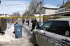 ERIK PINDERA/WINNIPEG FREE PRESS
                                Winnipeg police forensics investigators and other officers work in the lane of Beverley and Toronto streets, between Ellice and St. Matthews avenues, on Tuesday. Two women were found with gunshot wounds at about 6 a.m.; one had died by the time police arrived.