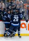 John Woods / THE CANADIAN PRESS
                                Kyle Capobianco (second from left) celebrates his goal against the Edmonton Oilers on Saturday with Jets teammates Nikolaj Ehlers (left), Blake Wheeler and Kevin Stenlund.