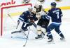 JOHN WOODS / THE CANADIAN PRESS
                                Boston Bruins&rsquo; Tyler Bertuzzi (59) attempts to tip the puck past Winnipeg Jets goaltender Connor Hellebuyck (37) as Vladislav Namestnikov (7) defends during second period NHL action in Winnipeg.
