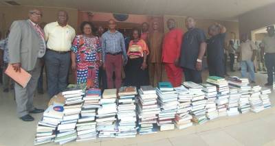 SUPPLIED
                                Uche Nwankwo (fourth from left) with books and study materials being donated to a school in Nigeria.