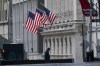 FILE - A security guard is seen next to a road block near the New York Stock exchange, Friday, Jan. 14, 2022, in the Financial District. (AP Photo/Mary Altaffer, File)