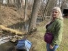 Sherry Bable stands beside Sulphur Run, a creek, Feb. 25, 2023, in East Palestine, Ohio, near the spot where a train derailed in a fiery crash Feb. 3. It's among local waterways where 
