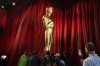 Workers move an Oscar statue during preparations for Sunday's 95th Academy Awards, Saturday, March 11, 2023, in Los Angeles. (AP Photo/John Locher)