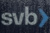 A sign to Silicon Valley Bank is seen through raindrops on a window in Santa Clara, Calif., Friday, March 10, 2023. The Federal Deposit Insurance Corporation is seizing the assets of Silicon Valley Bank, marking the largest bank failure since Washington Mutual during the height of the 2008 financial crisis. The FDIC ordered the closure of Silicon Valley Bank and immediately took position of all deposits at the bank Friday.(AP Photo/Jeff Chiu)