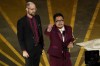 Daniel Scheinert, left, and Daniel Kwan accept the award for best original screenplay for 