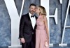 Jimmy Kimmel, left, and Molly McNearney arrive at the Vanity Fair Oscar Party on Sunday, March 12, 2023, at the Wallis Annenberg Center for the Performing Arts in Beverly Hills, Calif. (Photo by Evan Agostini/Invision/AP)