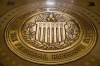 FILE- The seal of the Board of Governors of the United States Federal Reserve System is displayed in the ground at the Marriner S. Eccles Federal Reserve Board Building in Washington, Feb. 5, 2018. Facing the prospect of a third financial crisis in less than two decades, the Federal Reserve initiated a broad emergency lending program late Sunday, March 12, 2023, intended to shore up confidence in the nation's financial system following the collapse of two large banks with deep ties to the tech industry. (AP Photo/Andrew Harnik, File)
