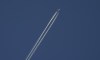An airliner cuts through the skies over Montreal, Wednesday, Dec. 23, 2020. Flair missed 'millions' in payments on seized planes, leasing company says. THE CANADIAN PRESS/Paul Chiasson