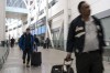 Passengers arrive at Pearson Airport in Mississauga, Ont. on Tuesday, March 14, 2023. The number of air passenger complaints to Canada's transport regulator has more than tripled over the past year, soaring past 42,000. THE CANADIAN PRESS/Chris Young