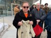 Victoria McIntosh holds a childhood jacket that her grandmother made for her that she wasn't able to bring with her to residential school, following her testimony at the Law Courts building in Winnipeg, Tuesday, March 7, 2023. THE CANADIAN PRESS/Brittany Hobson