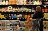 A customer looks over the beer selection at Crest Foods in Oklahoma City, Monday, Oct. 1, 2018. Beginning Monday grocery stores and convenience stores in Oklahoma can legally sell wine and strong beer. (AP Photo/Sue Ogrocki)