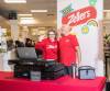 JESSICA LEE / WINNIPEG FREE PRESS
                                Zellers GM Ewa Turski waves while standing next to DJ Dave Filiatrault at the newly re-opened Zellers on the second floor of Hudson&rsquo;s Bay at St. Vital Mall on Tuesday.