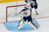 John Locher / The Associated Press
                                Goaltender Connor Hellebuyck is yet to singlehandedly win a game for the Jets in this season&rsquo;s playoffs.