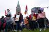 Public Service Alliance of Canada (PSAC) striking government workers walk a picket line around the front lawn of Parliament Hill, in Ottawa, Wednesday, April 26, 2023. THE CANADIAN PRESS/Adrian Wyld