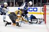 Vegas Golden Knights center Ivan Barbashev (49) shoots against Winnipeg Jets centre Kevin Stenlund (28) and goaltender Connor Hellebuyck in Game 5. (David Becker / The Associated Press)