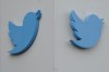 Twitter logos hang outside the company's offices in San Francisco, Monday, Dec. 19, 2022. A global journalism organization is calling on Twitter to correct its description of public broadcasters in Canada, Australia, New Zealand and South Korean. THE CANADIAN PRESS/AP-Jeff Chiu