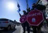 PSAC workers and supporters gather on a picket line in Ottawa on Thursday, April 20, 2023.&nbsp;A First Nation in southern Ontario says five federally run schools in its community are closed today as a result of a strike by federal public service workers. THE CANADIAN PRESS/Sean Kilpatrick